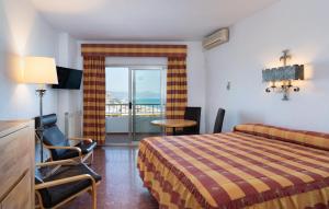 Postel nebo postele na pokoji v ubytování Hotel Apartamentos Bajondillo