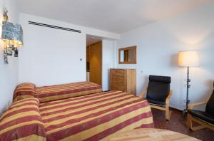 Postel nebo postele na pokoji v ubytování Hotel Apartamentos Bajondillo
