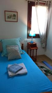A bed or beds in a room at VILLA ALCAZAR
