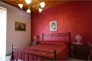 Posteľ alebo postele v izbe v ubytovaní Etna Dimora dei Saponari