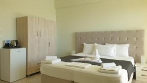 En eller flere senge i et værelse på Vista Marina