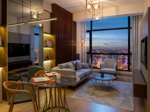 a living room with a couch and a table at G Tower Furnished Apartment Rentals in Istanbul