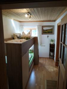 a small room with a kitchen with a counter top at Reithamer Bergfensterl in Warngau +22 photos