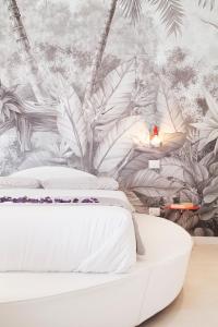 Giường trong phòng chung tại San Sebastiano Suite & Luxury Apartments