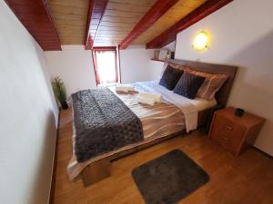 a bedroom with a large bed in a room at Apartment Orkić in Rovinj