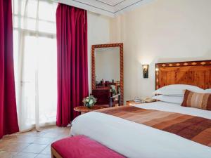 Ένα ή περισσότερα κρεβάτια σε δωμάτιο στο Hotel Le Médina Essaouira Thalassa sea & spa – Mgallery