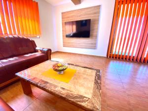 a living room with a couch and a coffee table at Apartment Eli Kacjak in Dramalj