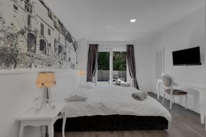 Posteľ alebo postele v izbe v ubytovaní Villa Prestige + 35 fotografií