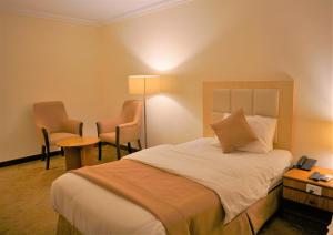 Postel nebo postele na pokoji v ubytování Silk Road Hotel + 34 fotografií
