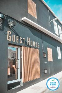 a guest house sign on the side of a building at Vintage Place - Azorean Guest House in Ponta Delgada