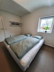Postel nebo postele na pokoji v ubytování På landet