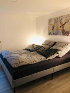 Ένα ή περισσότερα κρεβάτια σε δωμάτιο στο Ferienwohnung Waldblick