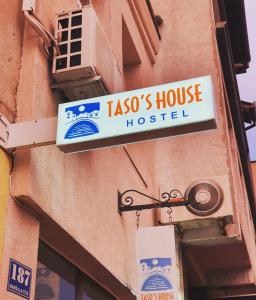 a sign on the side of a building at Hostel Taso's House in Mostar