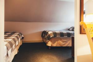 
A bed or beds in a room at Dundee Backpackers Hostel
