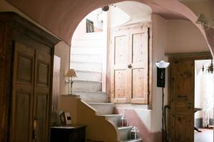 a hallway with stairs and a door in a building at BB Le Gemme in Dolceacqua +37 photos