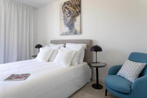 Posteľ alebo postele v izbe v ubytovaní Infinity Residence