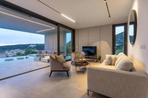 Televízia a/alebo spoločenská miestnosť v ubytovaní Infinity Residence