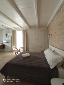 Postel nebo postele na pokoji v ubytování La Porta Vecchia Home