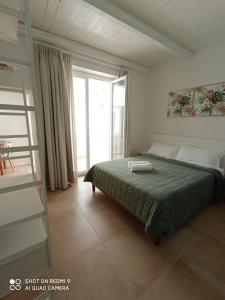 Postel nebo postele na pokoji v ubytování La Porta Vecchia Home