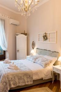En eller flere senger på et rom på La Mansarda Segreta Mood Apartment