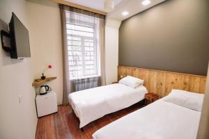 Ένα ή περισσότερα κρεβάτια σε δωμάτιο στο Lori Guest House Hotel