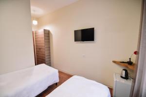 Ένα ή περισσότερα κρεβάτια σε δωμάτιο στο Lori Guest House Hotel
