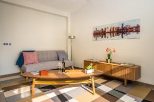 a living room with a couch and a table at Mar Apartment in Altea
