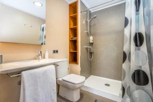 a bathroom with a toilet and a shower at Mar Apartment in Altea +20 photos