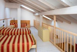 Postel nebo postele na pokoji v ubytování Albergo Alla Comparsa