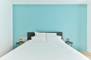 מיטה או מיטות בחדר ב-VILLA14