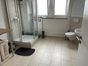 a bathroom with a shower and a toilet at L8 Street - Pforzheim Nordstadt in Pforzheim