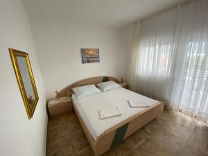 Postel nebo postele na pokoji v ubytování Villa Janja