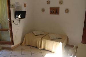 En eller flere senge i et værelse på Casa Miclara appartamento -- Ortensia