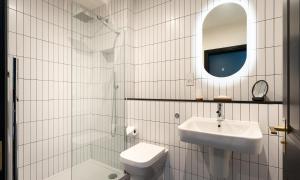 a bathroom with a sink and a toilet and a mirror at Sweden Lodge - wonderful property in Ambleside in Ambleside