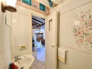 a bathroom with a sink and a toilet in a room at holidaycasa Gio - in centro vista mare in Sperlonga