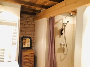 a bedroom with a vanity and a mirror on a wall at Le Clos de Miribel in Givry