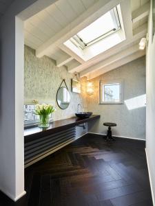 a bathroom with a sink and a mirror at OBERDAN SUITE Appartamento nel cuore di Bologna in Bologna