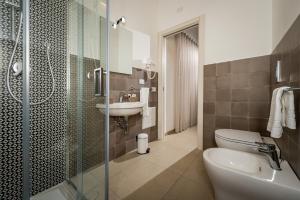 a bathroom with a toilet and a sink and a shower at Affittacamere Nanà in Castellammare del Golfo +43 photos