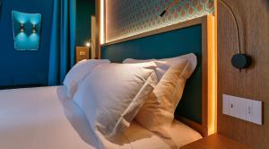 מיטה או מיטות בחדר ב-Porto Vecchio Appartamenti