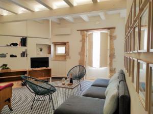 Televízia a/alebo spoločenská miestnosť v ubytovaní Suite Bagnara- Ortigia Holidays