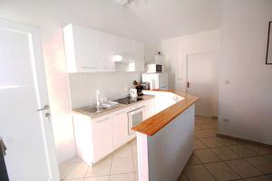 Kuchyň nebo kuchyňský kout v ubytování Apartman Eli 2