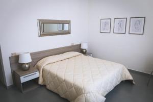 Postel nebo postele na pokoji v ubytování LOCANDA Roma sleep & food