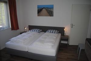 Postel nebo postele na pokoji v ubytování Villa Dunopark 49