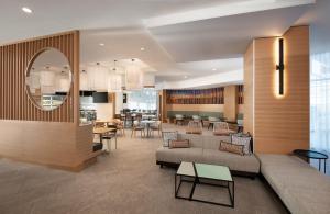 a living room with a couch and a table at Hyatt Place Tempe Phoenix University in Tempe