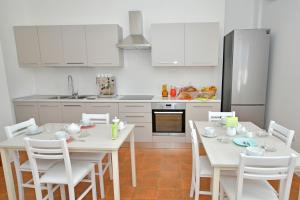 Kuchyň nebo kuchyňský kout v ubytování B&B Linae - Residence + 37 fotografií