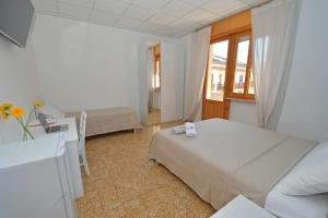 Postel nebo postele na pokoji v ubytování B&B Linae - Residence