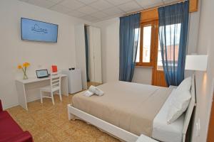 Postel nebo postele na pokoji v ubytování B&B Linae - Residence