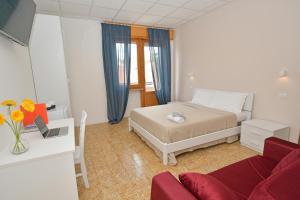 Postel nebo postele na pokoji v ubytování B&B Linae - Residence