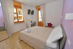 Postel nebo postele na pokoji v ubytování B&B Linae - Residence