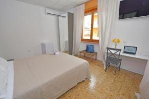 Postel nebo postele na pokoji v ubytování B&B Linae - Residence